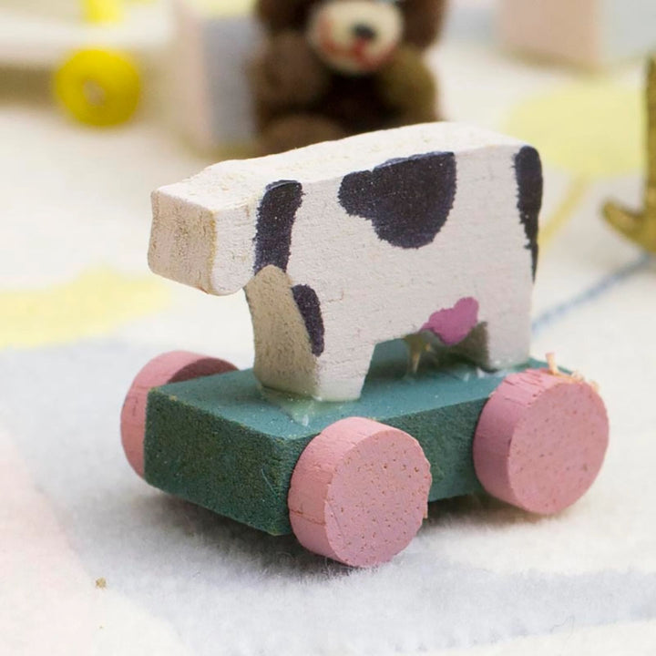 Dollhouse Miniatures: Antique Cow Pull Toy